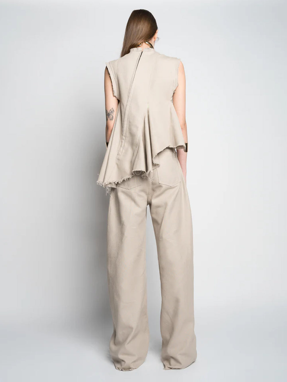 Woven Cotton Sleeveless Top With Stitched Pleats And Assymetric Flounce Hem Beige