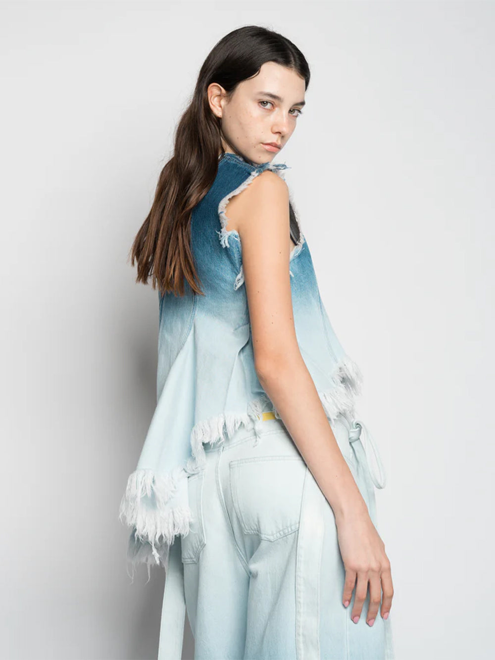 Ombre Denim Sleeveless Top With Stitched Down Pleats And Assymetric Flounce Hem Ombre Denim Blue