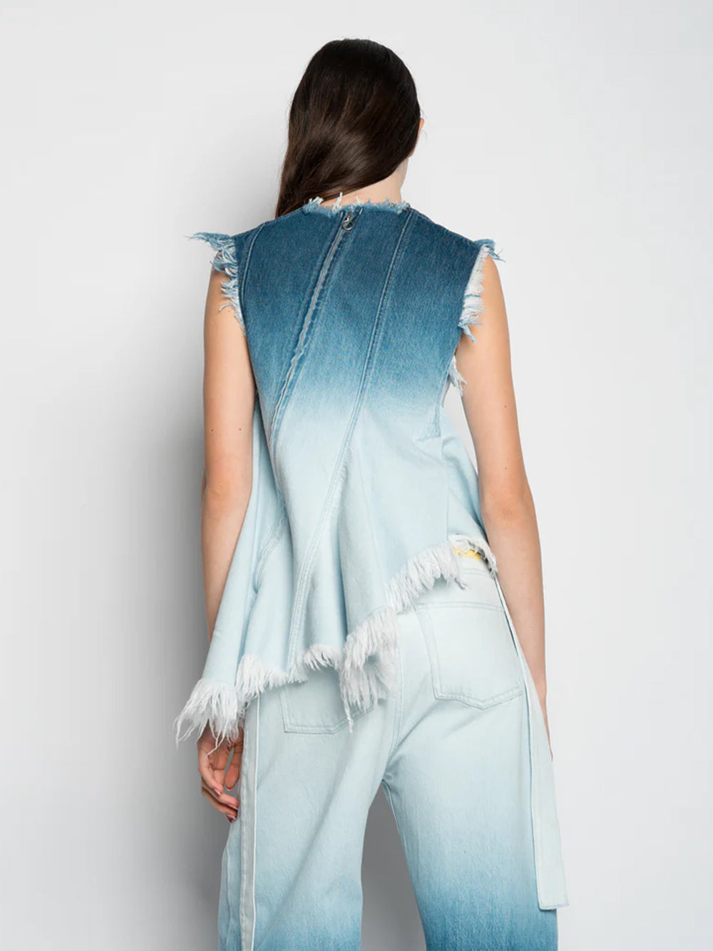 Ombre Denim Sleeveless Top With Stitched Down Pleats And Assymetric Flounce Hem Ombre Denim Blue